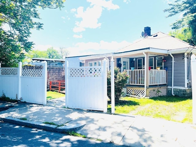 173 Brookway Rd, Boston, MA 02131 - view of front facade featuring covered porch and a chimney
