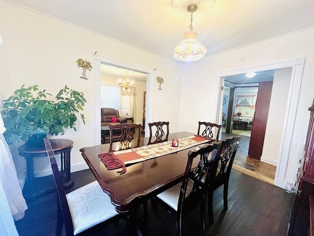 173 Brookway Rd, Boston, MA 02131 - dining space featuring a chandelier, dark wood-style floors, and baseboards