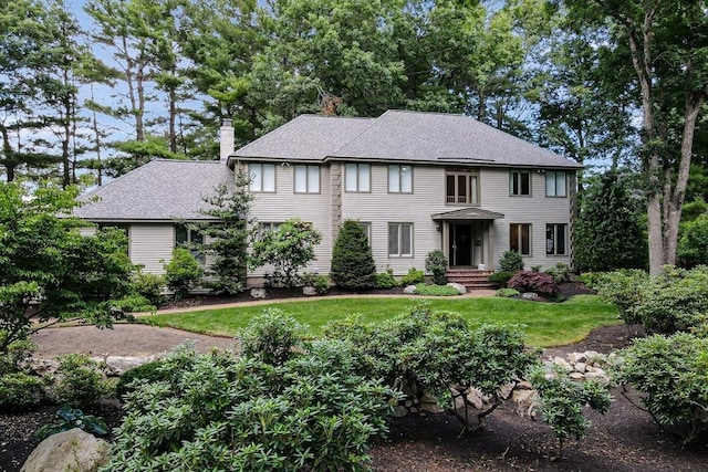 28 Smithshire Ests, Andover, MA 01810 - colonial house with a chimney, a front yard, and roof with shingles
