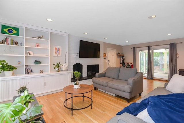 28 Smithshire Ests, Andover, MA 01810 - living room featuring light wood-style floors, a fireplace, and recessed lighting