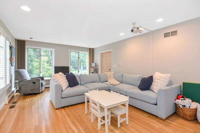 28 Smithshire Ests, Andover, MA 01810 - living area with light wood-style floors, recessed lighting, and baseboard heating