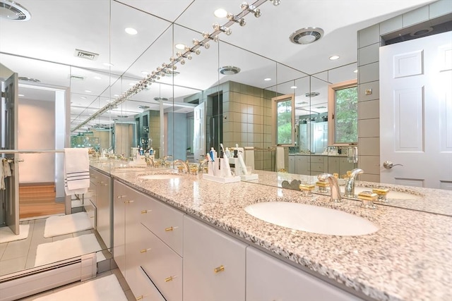 28 Smithshire Ests, Andover, MA 01810 - bathroom featuring double vanity, a stall shower, and recessed lighting