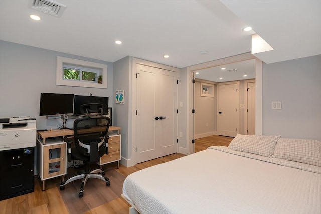 28 Smithshire Ests, Andover, MA 01810 - bedroom featuring wood finished floors, a desk, a closet, and recessed lighting