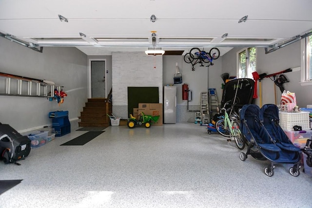 28 Smithshire Ests, Andover, MA 01810 - garage with a central vacuum unit and a garage door opener