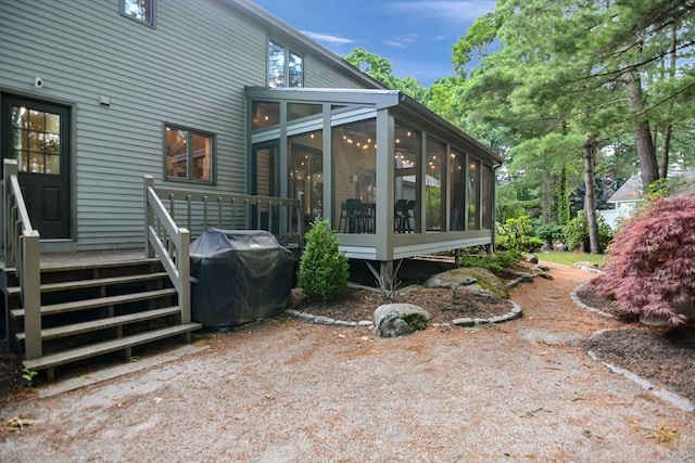 28 Smithshire Ests, Andover, MA 01810 - rear view of property with a sunroom