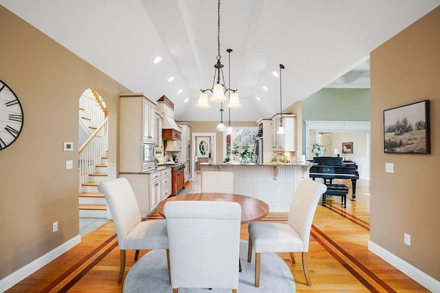 7 Buckhide Rd, Windham, NH 03087 - dining room featuring light wood finished floors, vaulted ceiling, baseboards, stairway, and recessed lighting