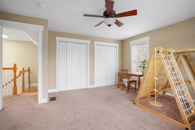 7 Buckhide Rd, Windham, NH 03087 - carpeted bedroom with multiple closets, baseboards, and a ceiling fan