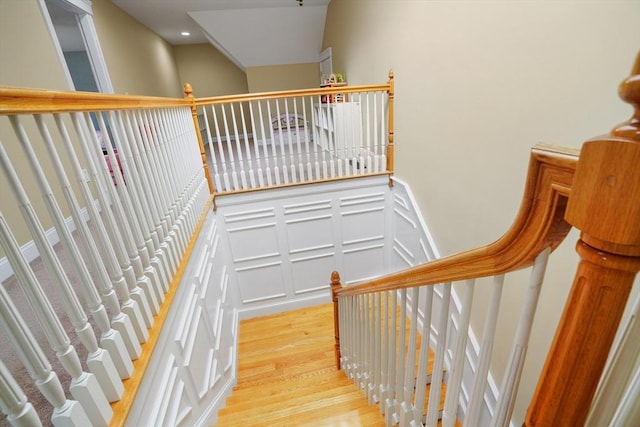 7 Buckhide Rd, Windham, NH 03087 - stairway with wood finished floors, a decorative wall, and a wainscoted wall