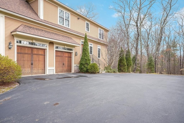 7 Buckhide Rd, Windham, NH 03087 - view of home's exterior featuring asphalt driveway and an attached garage
