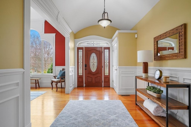 7 Buckhide Rd, Windham, NH 03087 - foyer featuring wainscoting, vaulted ceiling, wood finished floors, and a decorative wall