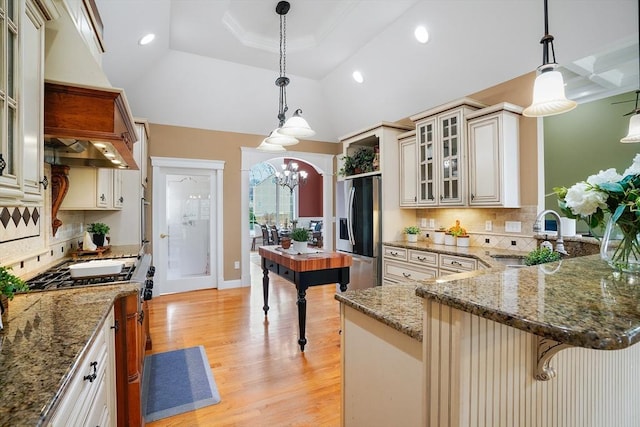 7 Buckhide Rd, Windham, NH 03087 - kitchen featuring cream cabinets, stainless steel fridge, a sink, gas range, and a chandelier