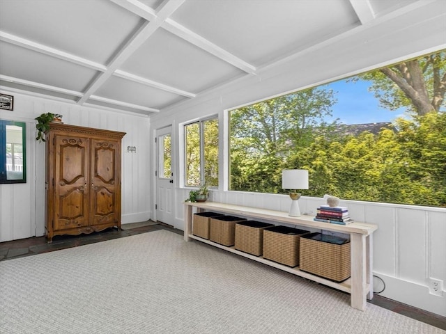 sunroom featuring beamed ceiling