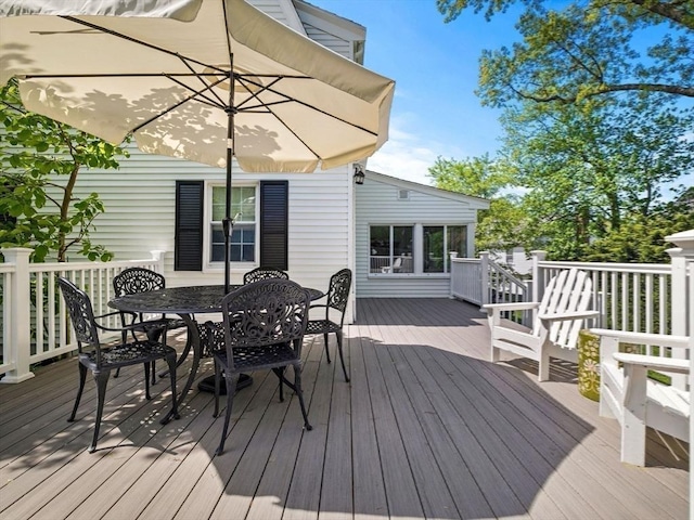 wooden deck with outdoor dining area