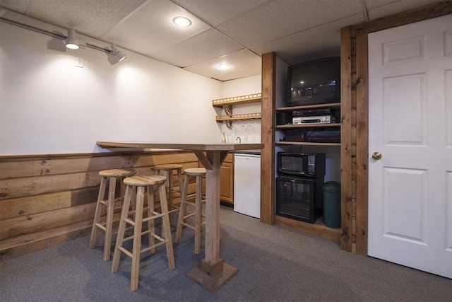 769 Federal St, Belchertown, MA 01007 - indoor wet bar featuring black microwave, refrigerator, dark colored carpet, a paneled ceiling, and wine cooler