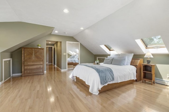 2 Harding Rd, Medway, MA 02053 - bedroom with a skylight, lofted ceiling, light wood finished floors, a baseboard radiator, and recessed lighting