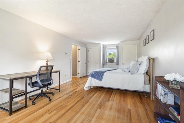2 Harding Rd, Medway, MA 02053 - bedroom with light wood-style floors and a textured ceiling