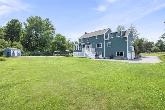 2 Harding Rd, Medway, MA 02053 - back of property featuring a storage shed, stairs, and a garage