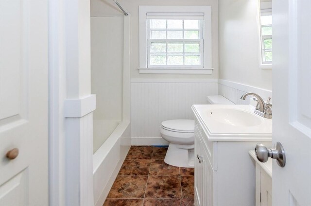10 Briggs Ln, Marion, MA 02738 - full bathroom featuring vanity, healthy amount of natural light, wainscoting, toilet, and tub / shower combination