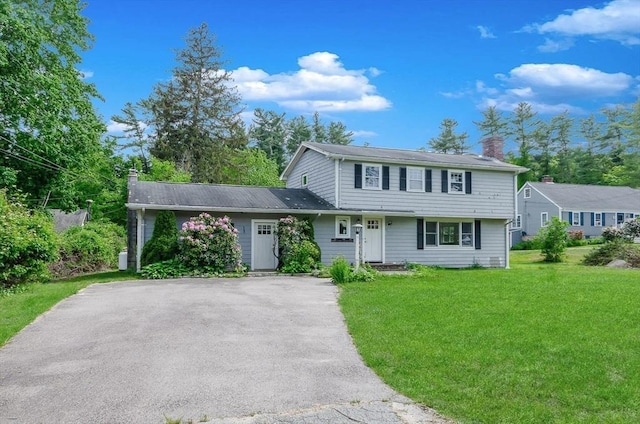 10 Briggs Ln, Marion, MA 02738 - colonial house featuring a chimney, a front lawn, and asphalt driveway