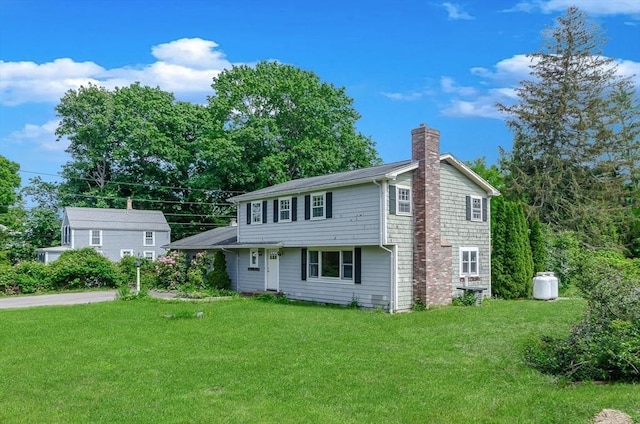 10 Briggs Ln, Marion, MA 02738 - view of front facade with a chimney and a front lawn