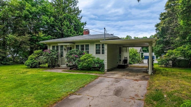 16 Stoneledge Rd, Dartmouth, MA 02748 - view of front facade featuring driveway, a chimney, a front yard, and a carport