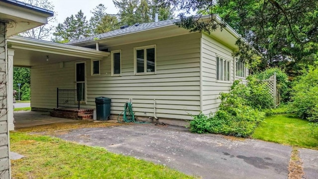 16 Stoneledge Rd, Dartmouth, MA 02748 - view of home's exterior featuring a lawn