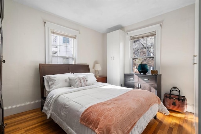 bedroom featuring dark hardwood / wood-style flooring