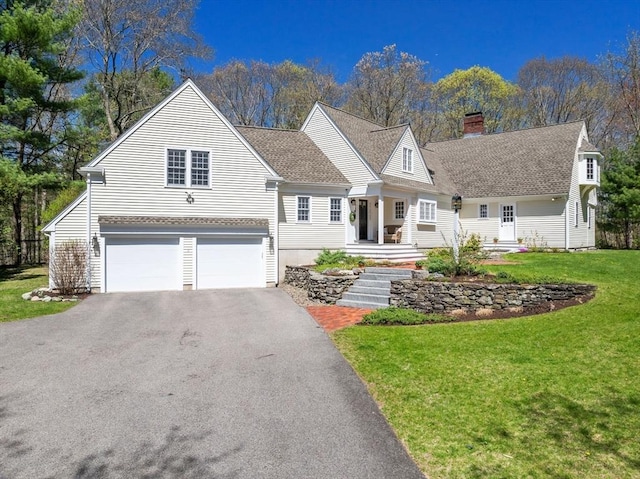 view of front of home with a garage, a chimney, roof with shingles, and aphalt driveway