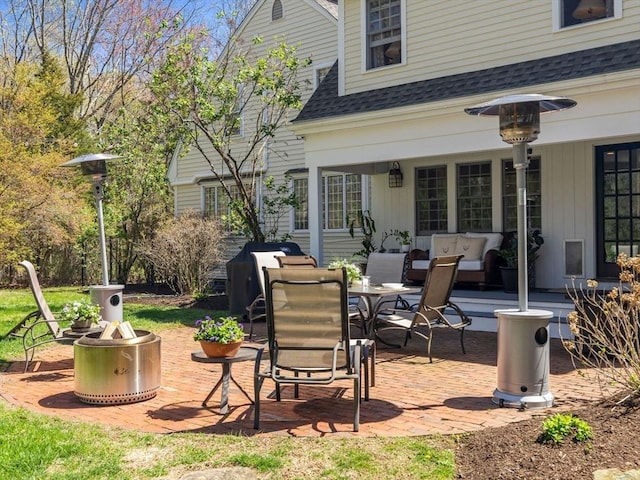 view of patio / terrace featuring outdoor dining space and an outdoor fire pit