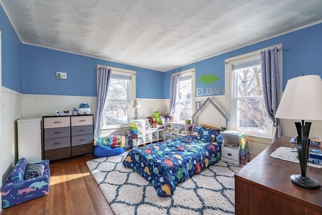 bedroom with dark wood-type flooring