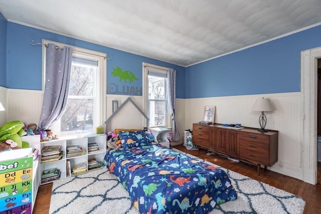 bedroom featuring dark wood-type flooring and multiple windows