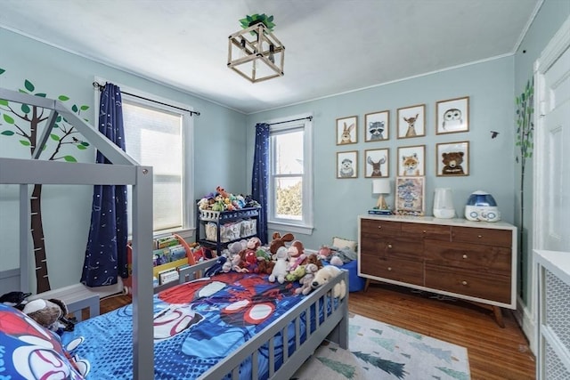 bedroom with hardwood / wood-style flooring