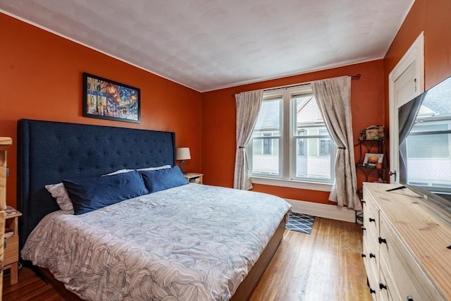 bedroom with hardwood / wood-style flooring