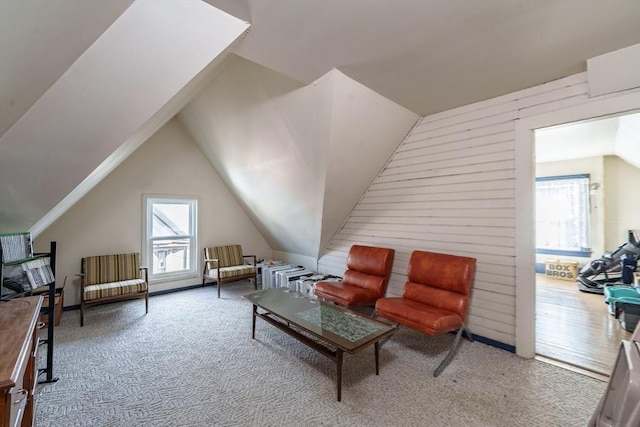 bonus room featuring vaulted ceiling, carpet, and a wealth of natural light