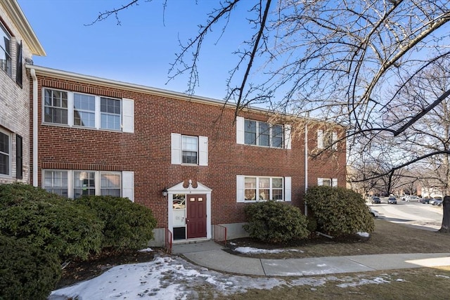 view of front of property featuring brick siding