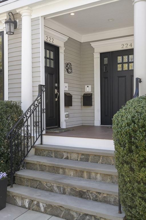view of exterior entry featuring covered porch