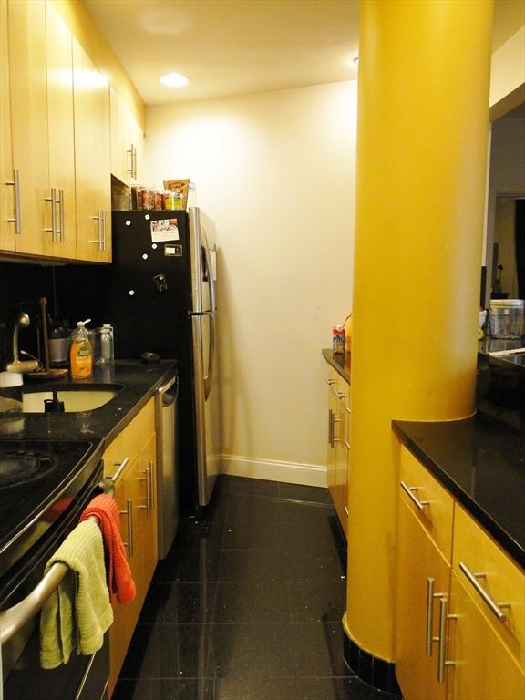 kitchen with backsplash, stainless steel dishwasher, and sink