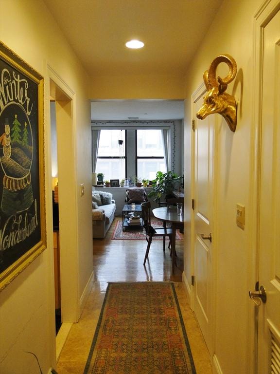 hallway with light wood-type flooring