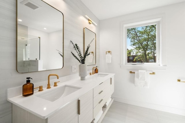 31 Evergreen St Unit 2, Boston, MA 02130 - bathroom with baseboards and double vanity