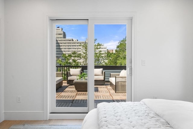 31 Evergreen St Unit 2, Boston, MA 02130 - bedroom featuring multiple windows, access to outside, and wood finished floors