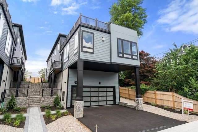 31 Evergreen St Unit 2, Boston, MA 02130 - contemporary home with a balcony, driveway, a carport, and an attached garage