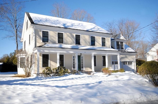 view of front of property featuring a garage and a porch