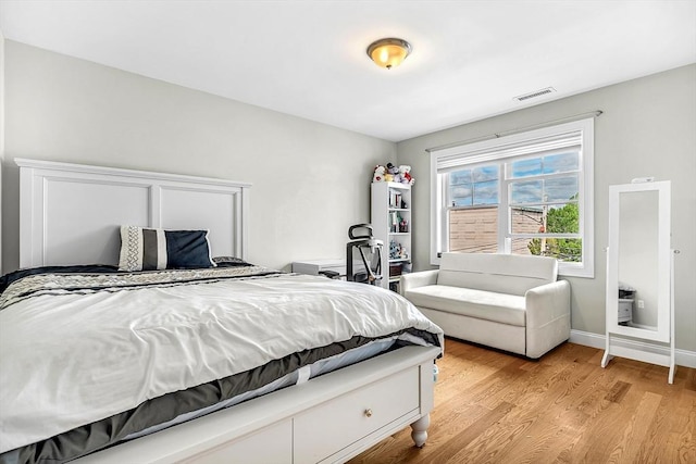 3 Lowell St Unit 1, Waltham, MA 02453 - bedroom with light wood finished floors and baseboards