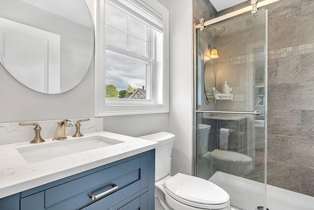 3 Lowell St Unit 1, Waltham, MA 02453 - bathroom with toilet, vanity, and a shower stall