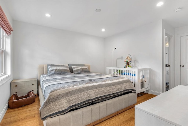 3 Lowell St Unit 1, Waltham, MA 02453 - bedroom with light wood-style flooring, baseboards, and recessed lighting