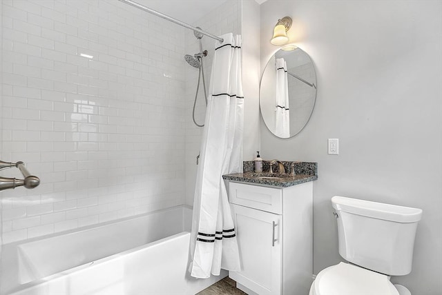 3 Lowell St Unit 1, Waltham, MA 02453 - bathroom featuring shower / tub combo, vanity, and toilet