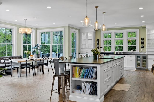 14 Reiling Pond Rd, Lincoln, MA 01773 - kitchen with wine cooler, dark countertops, crown molding, open shelves, and hardwood / wood-style flooring