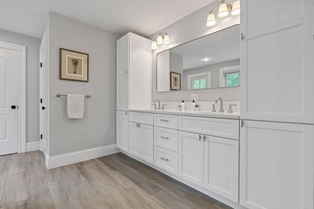 14 Reiling Pond Rd, Lincoln, MA 01773 - bathroom featuring double vanity and wood finished floors