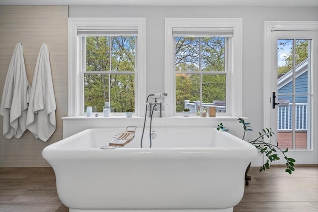 14 Reiling Pond Rd, Lincoln, MA 01773 - bathroom with a freestanding tub, healthy amount of natural light, and wood finished floors