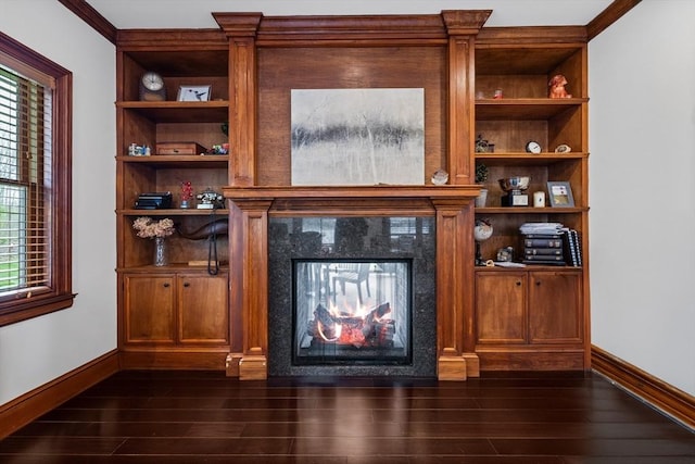 14 Reiling Pond Rd, Lincoln, MA 01773 - unfurnished living room featuring dark wood-type flooring, built in shelves, and a premium fireplace